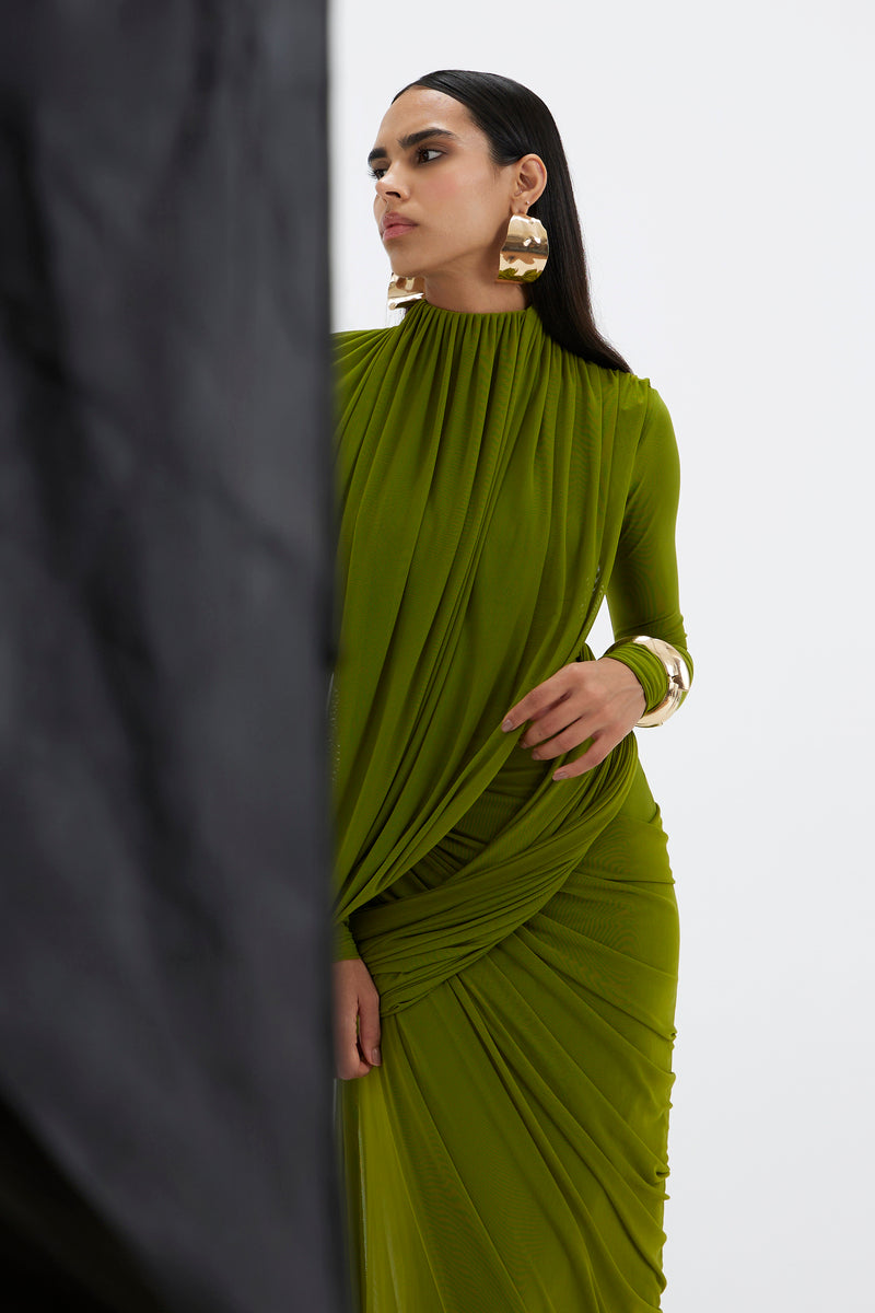 Deme By Gabriella Suzie Maxi Dress in flowing fabric with a floral pattern, full-length design, and sleeveless style.