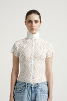 Deme By Gabriella Florence off-white top featuring a stylish, lightweight design with a relaxed fit and elegant neckline.
