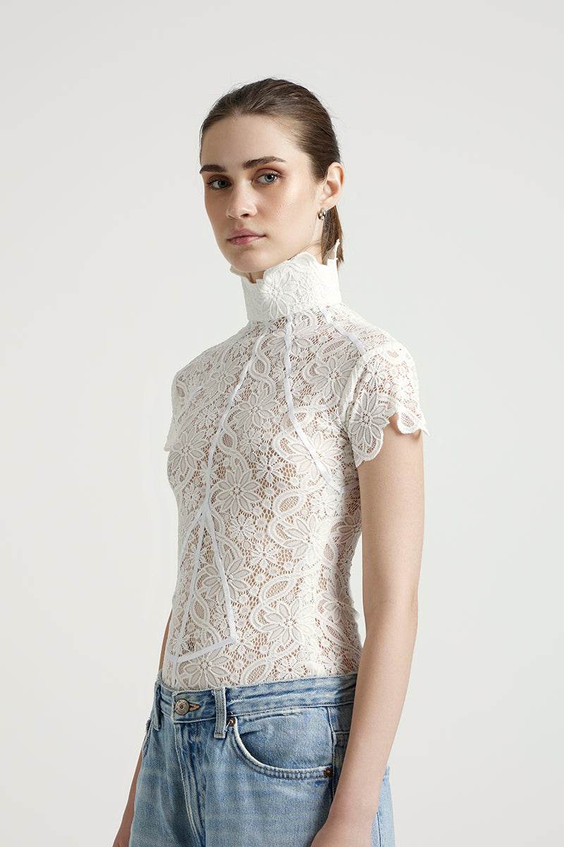 Deme By Gabriella Florence off-white top with long sleeves and a relaxed fit, styled casually.