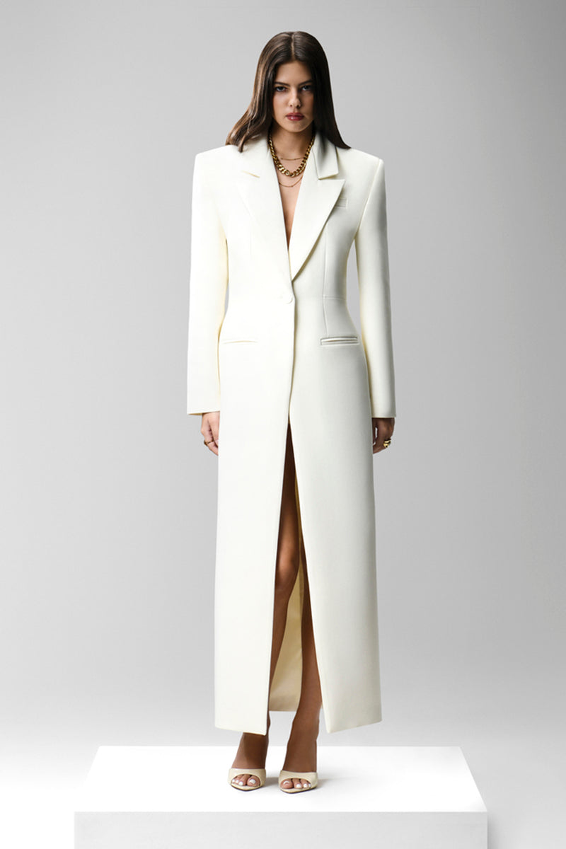 Matters ivory CELINE coat displayed on hanger with detailed fabric texture and classic design.