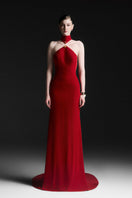 Red Zafielle halter floor-length gown by Maison Des Copains, flowing fabric and elegant design for formal occasions.