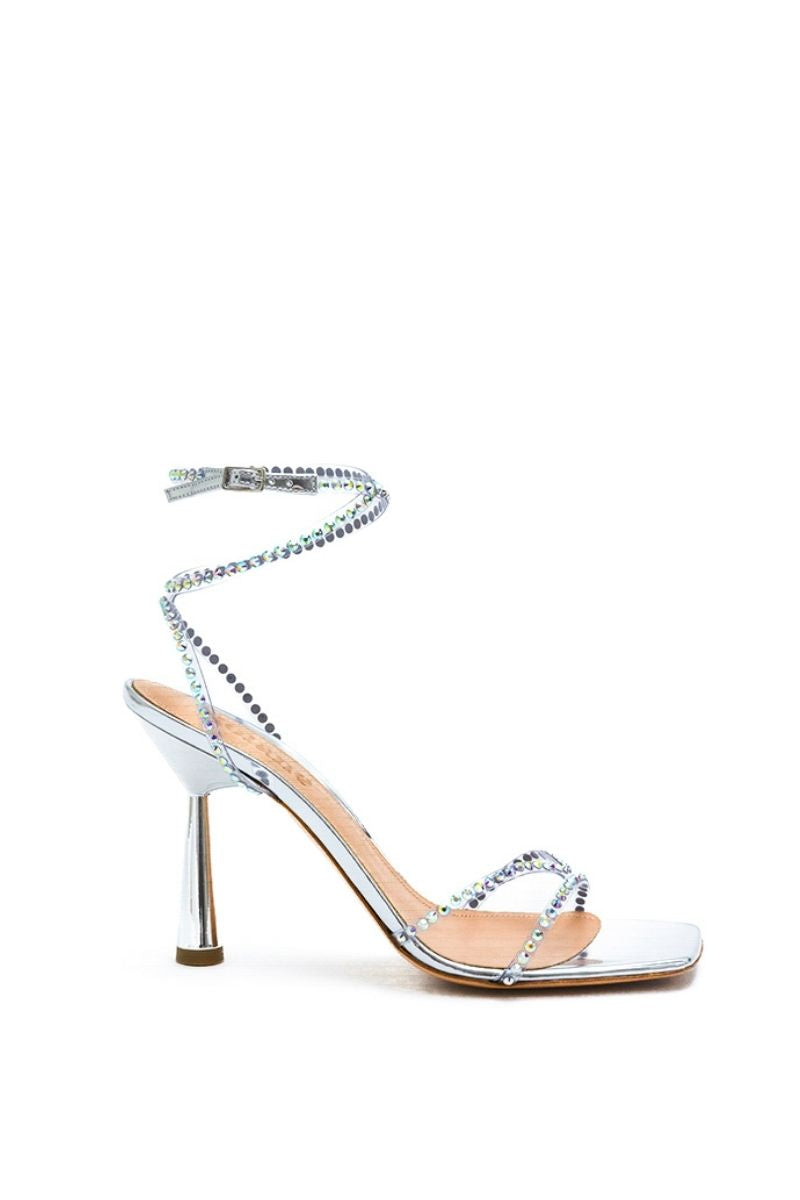 Silver crystal Kolane Kim sandal with transparent straps and open toe, styled for elegant summer wear.