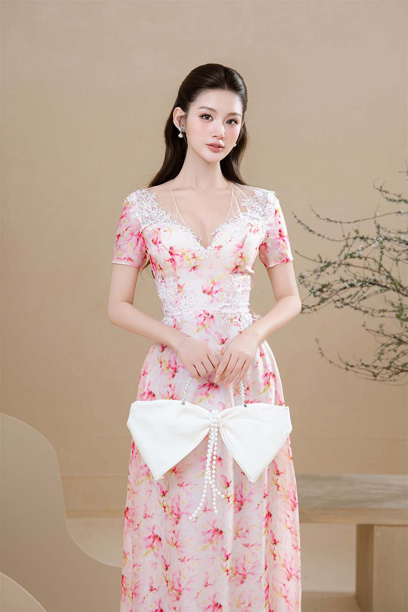 Do Long Peach Blossom Gown featuring delicate floral embroidery and flowing fabric, perfect for elegant occasions.
