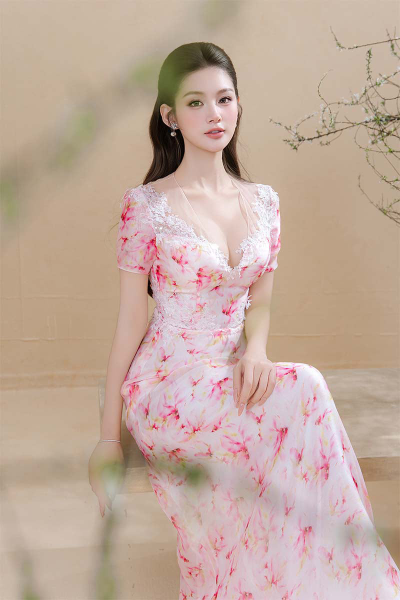 Pink Maxi Dress by Do Long, spring-themed floral design, flowing fabric, and elegant silhouette in this image.