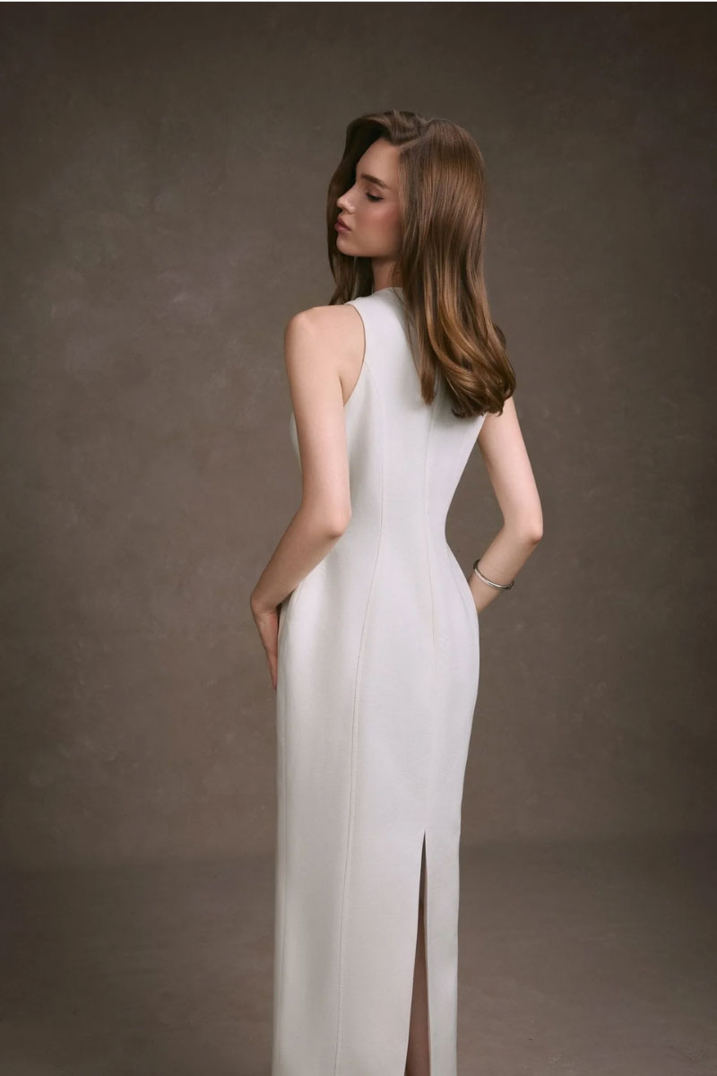 Elegant black lace peek maxi dress by KEIRA TONG, featuring intricate lace details and a flowing silhouette.