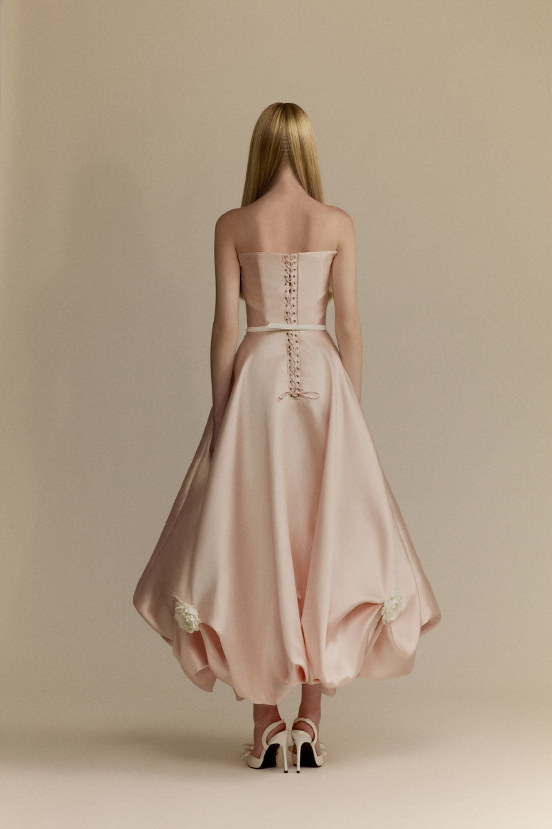 White Plan Gardenia Gown featuring elegant floral design and flowing fabric, perfect for formal or special occasions.