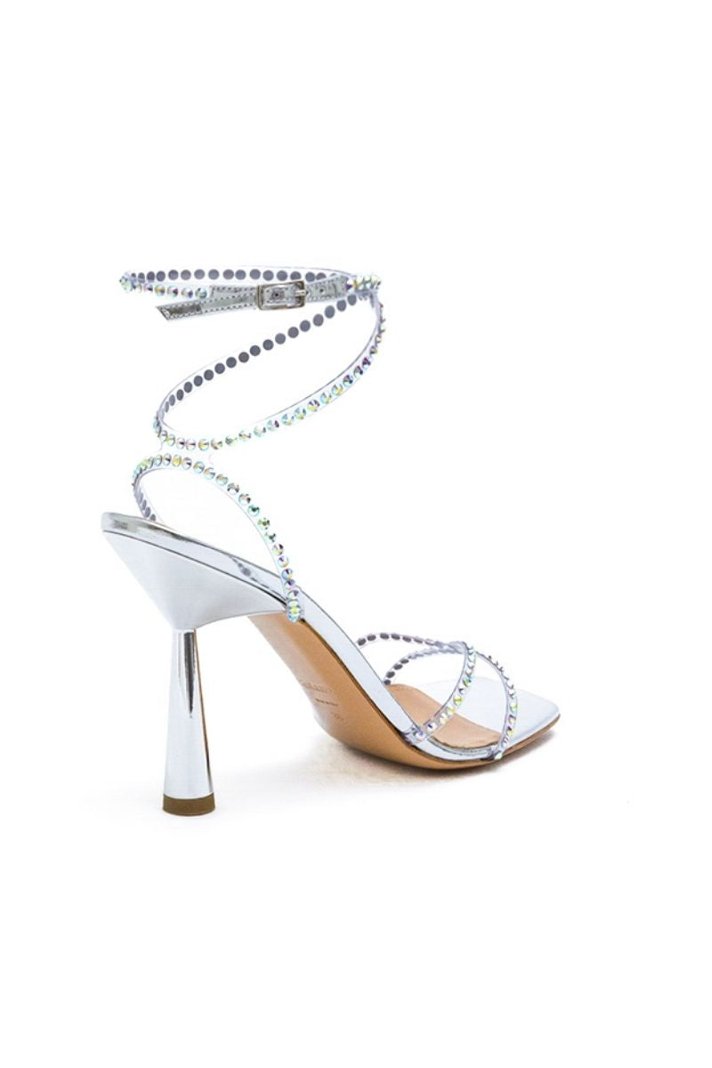 Kolane Kim silver crystal transparent sandals with clear straps and silver embellishments, perfect for stylish summer wear.