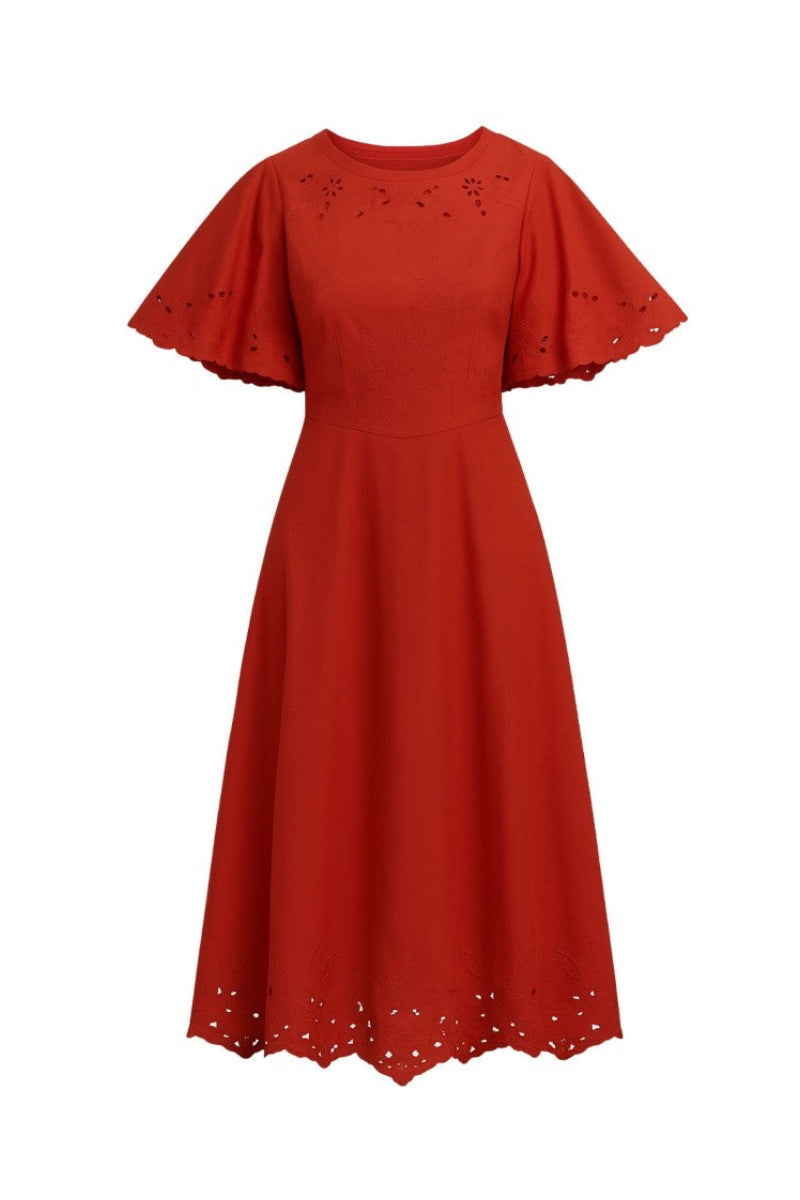 Rebecca Taylor Rachelle Burnt Sienna midi dress displayed on a hanger with flowing fabric and elegant design details.