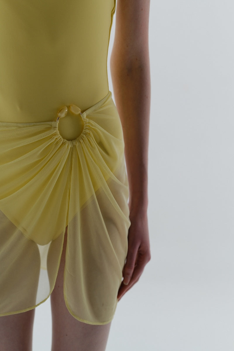 Baobab NERANO mini skirt in solid color, shown with a fitted waistband and short hem, casual and stylish women's mini skirt.