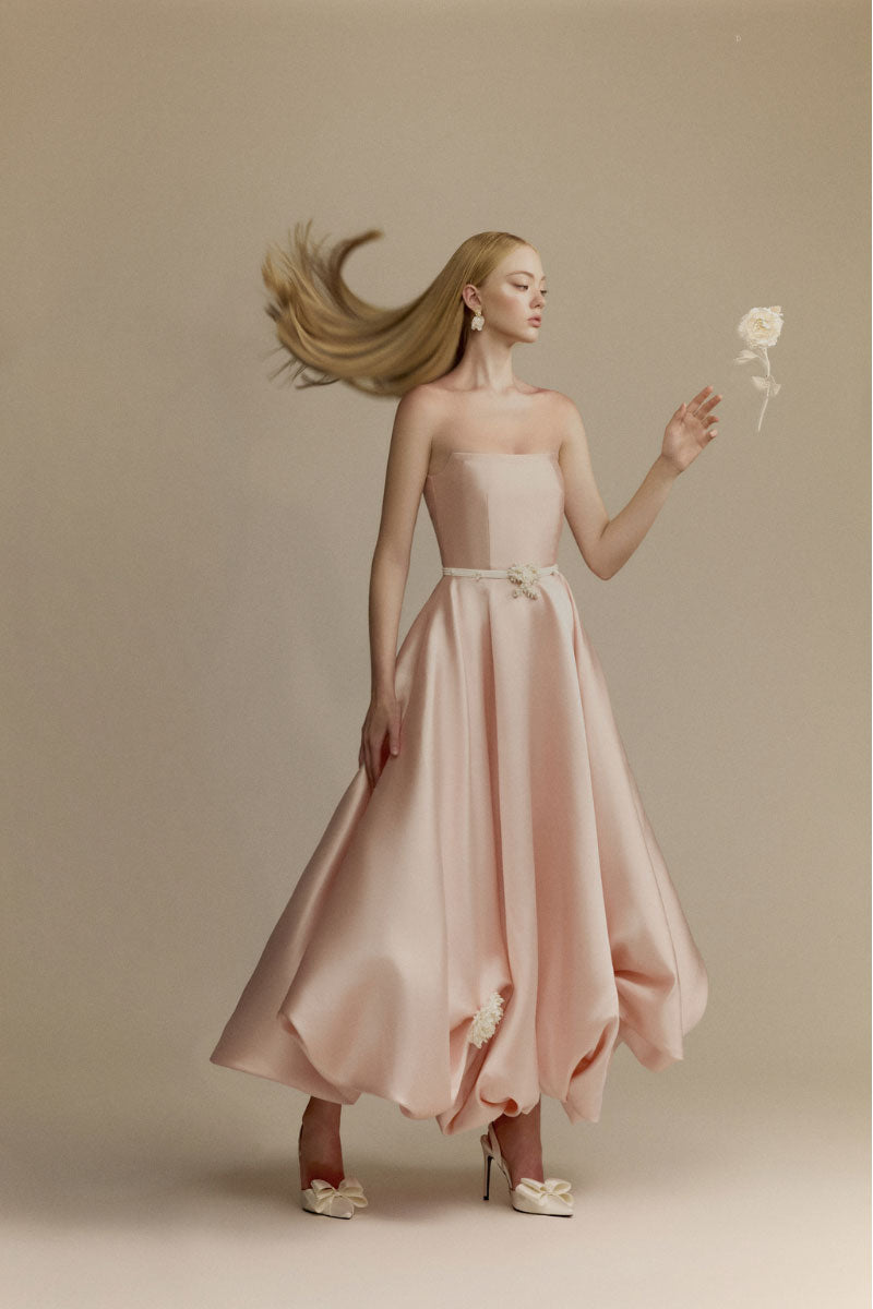 Elegant white Gardenia Dress gown by White Plan, showcasing flowing fabric and intricate design details on a model.