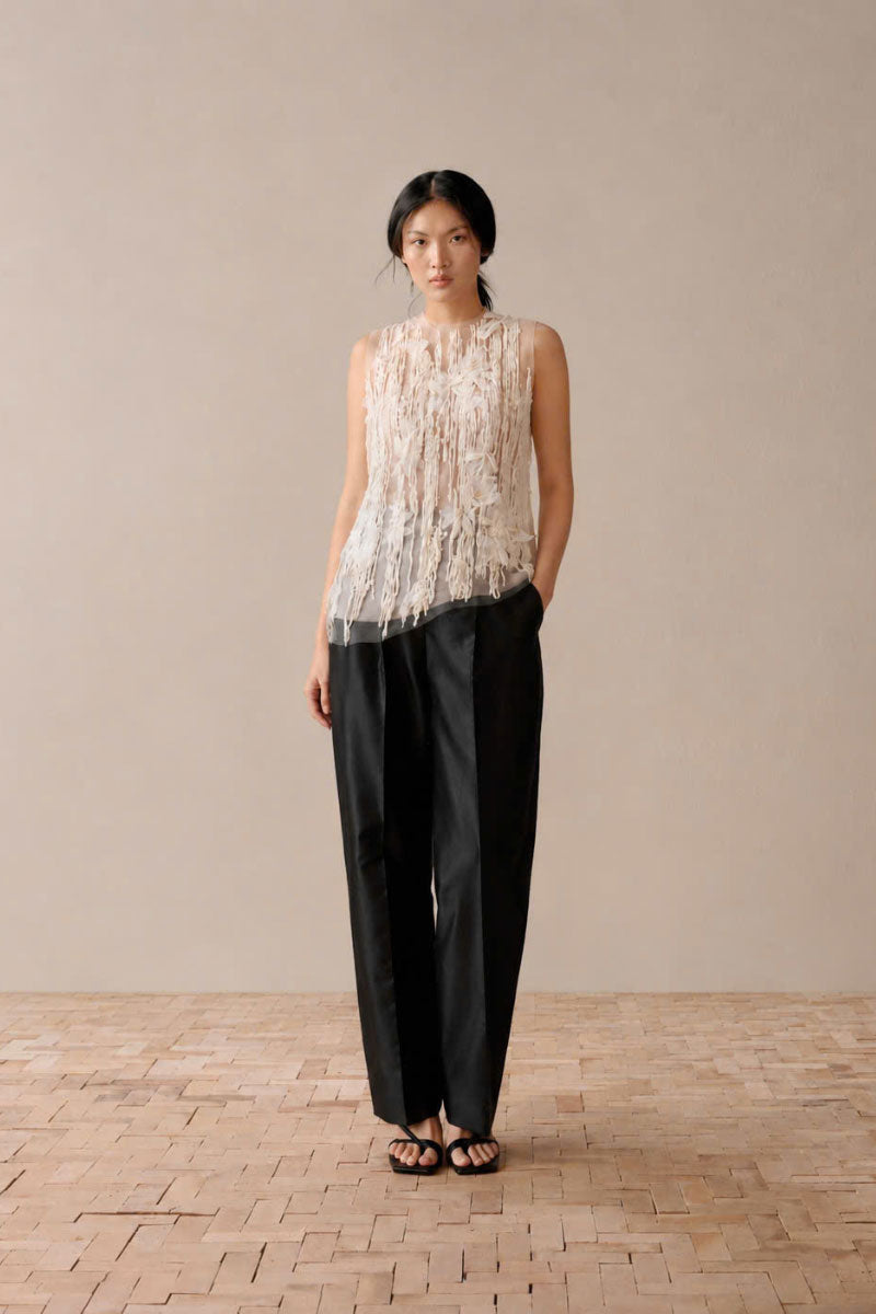White Levia embroidered see-through top with intricate embroidery and lightweight, sheer fabric, perfect for stylish layered looks.