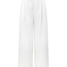 White JEMMIA pants by Arti Apparel, featuring a relaxed fit with pockets and stylish design, shown on a model.