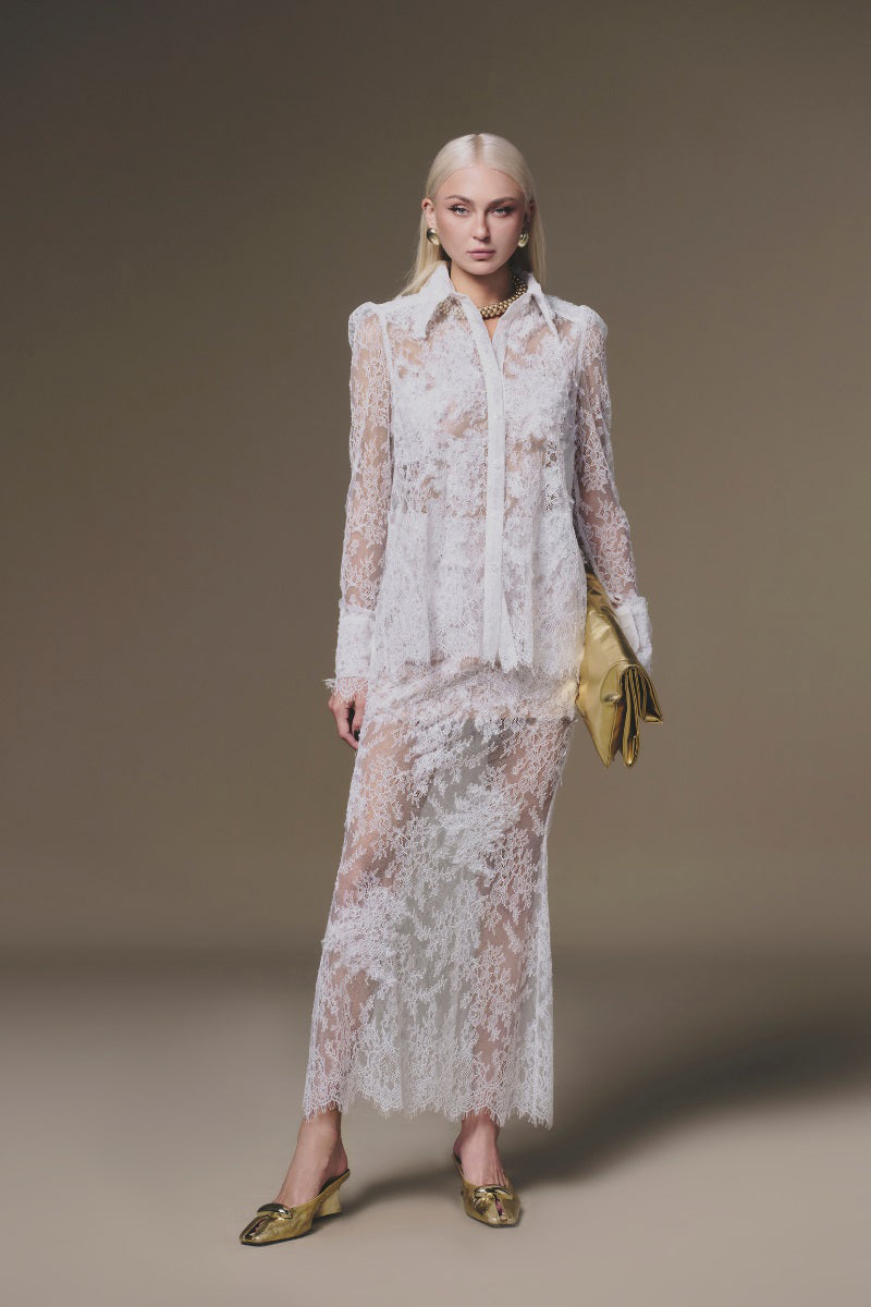 White petal sheer maxi skirt by Keira Tong featuring flowy fabric and floral design, full length with a lightweight, airy style.