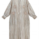 Floral embroidered oversized shirt dress with inner dress, maxi length, by SHATHA ESSA, featuring colorful floral patterns and flowing fabric.