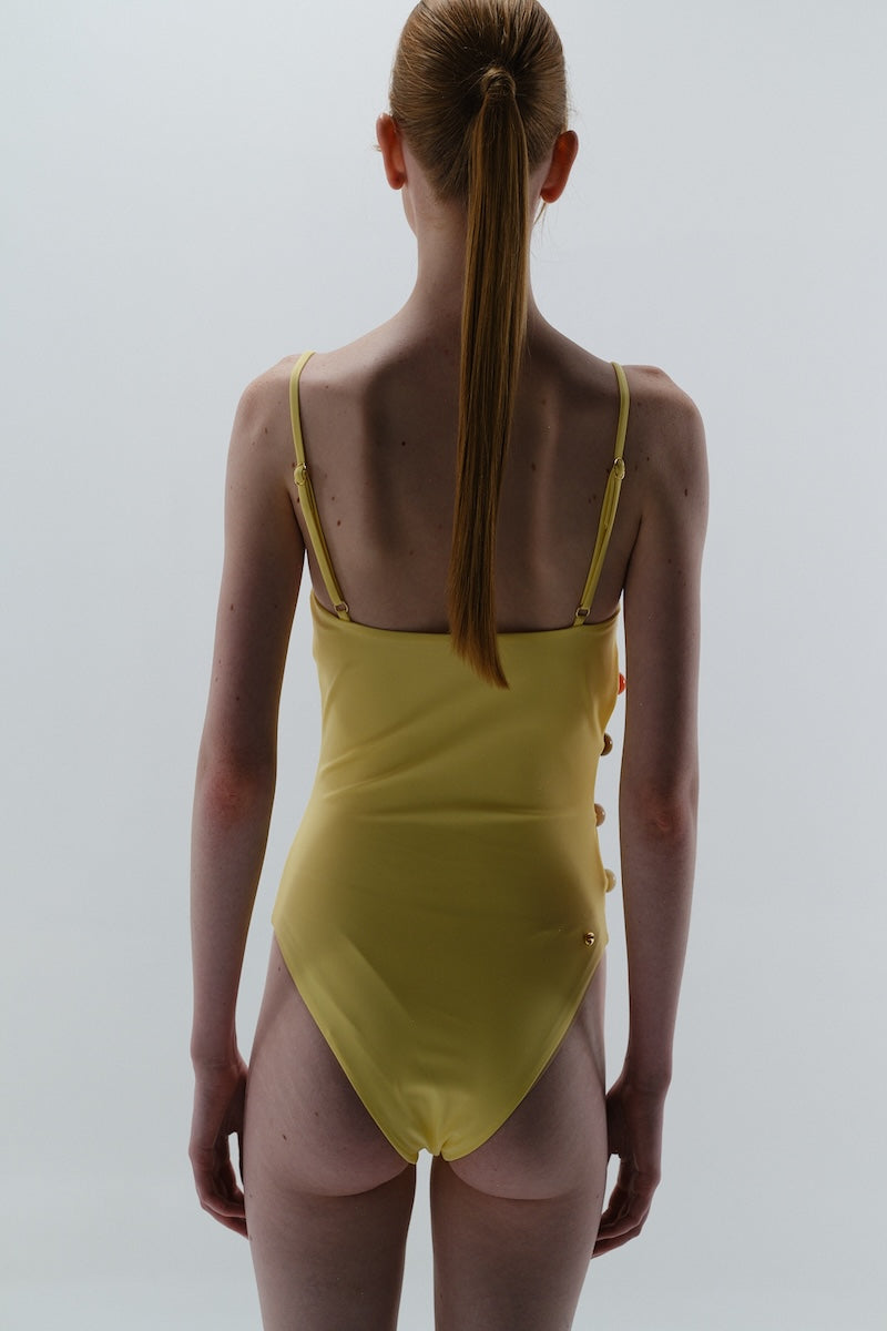 Baobab WAYRA one-piece swimsuit in solid color, featuring a sleek, fitted design perfect for swimming and beachwear.