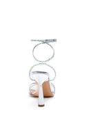 Silver crystal Kolane Kim sandal featuring transparent straps with sparkling embellishments.