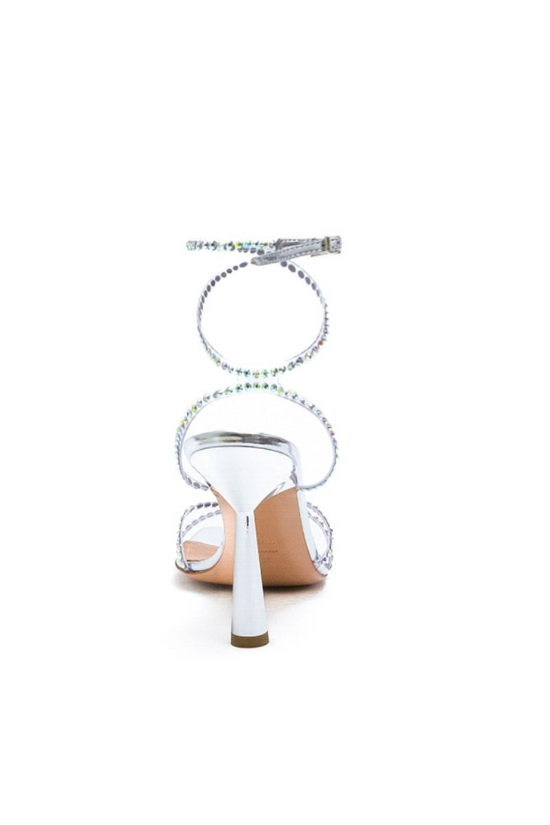 Silver crystal Kolane Kim sandal featuring transparent straps with sparkling embellishments.