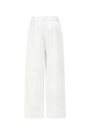 Arti Apparel JEMMIA white pants, fitted with a high waist and sleek design, shown on a model.
