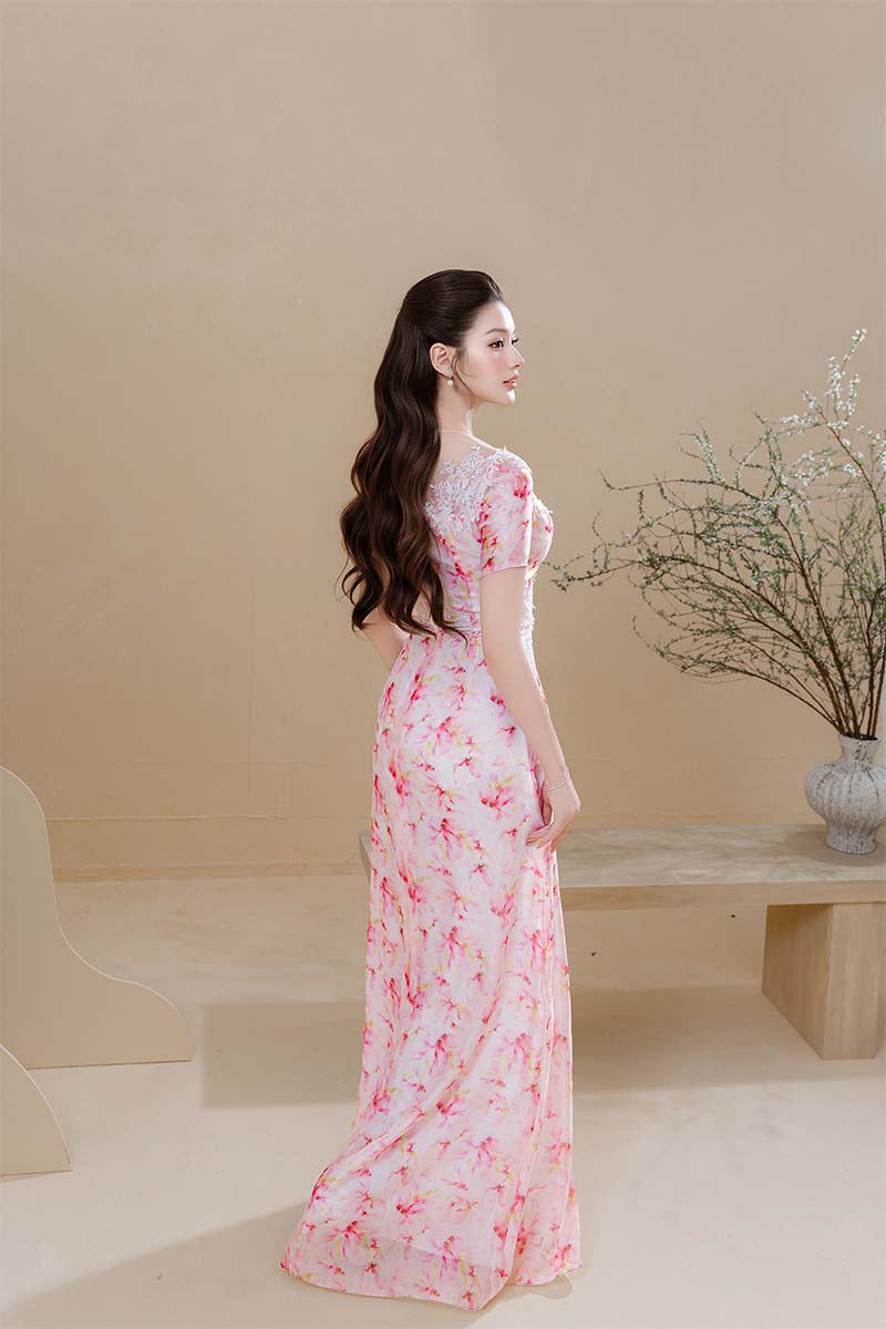 Pink maxi dress by Do Long featuring a flowing design, perfect for spring occasions and casual or semi-formal wear.