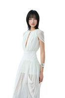 Light pale whisper midi dress by Do Long, featuring a flowing fabric and elegant design perfect for casual or semi-formal occasions.