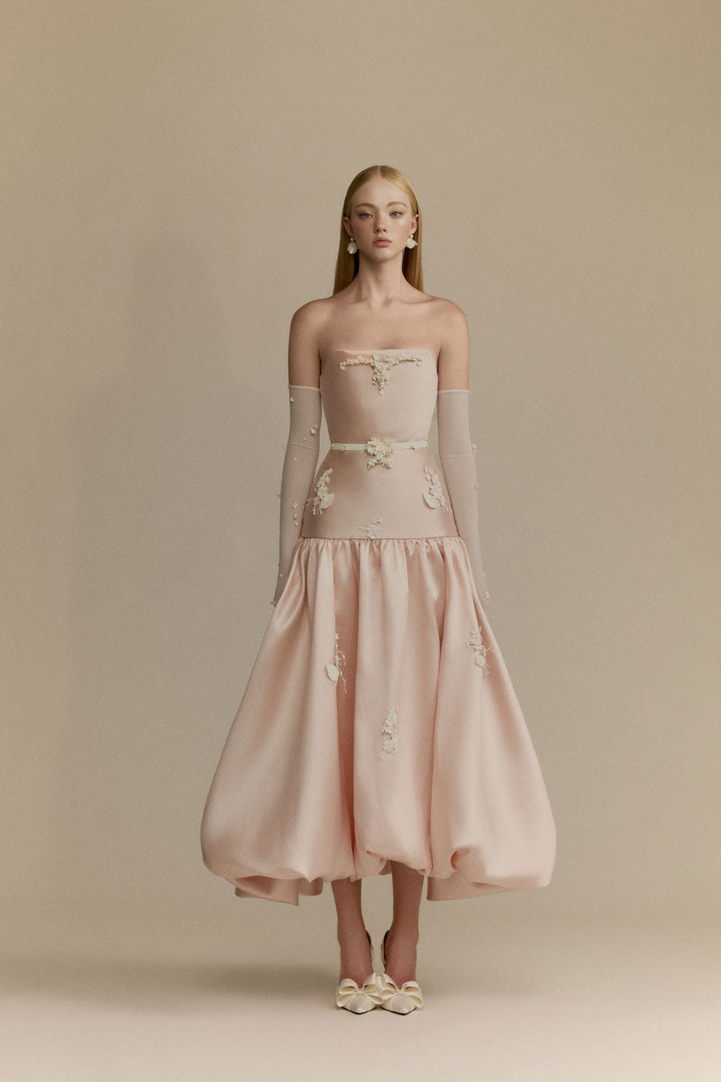 White Plan Lumi pink gown featuring a flowing fabric and elegant design, perfect for formal occasions