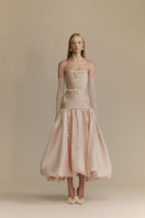 White Plan Lumi pink gown featuring a flowing fabric and elegant design, perfect for formal occasions