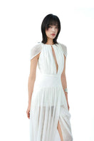 Do Long Pale Whisper midi dress displayed on a hanger, featuring a soft pastel color and elegant midi length for stylish occasions.