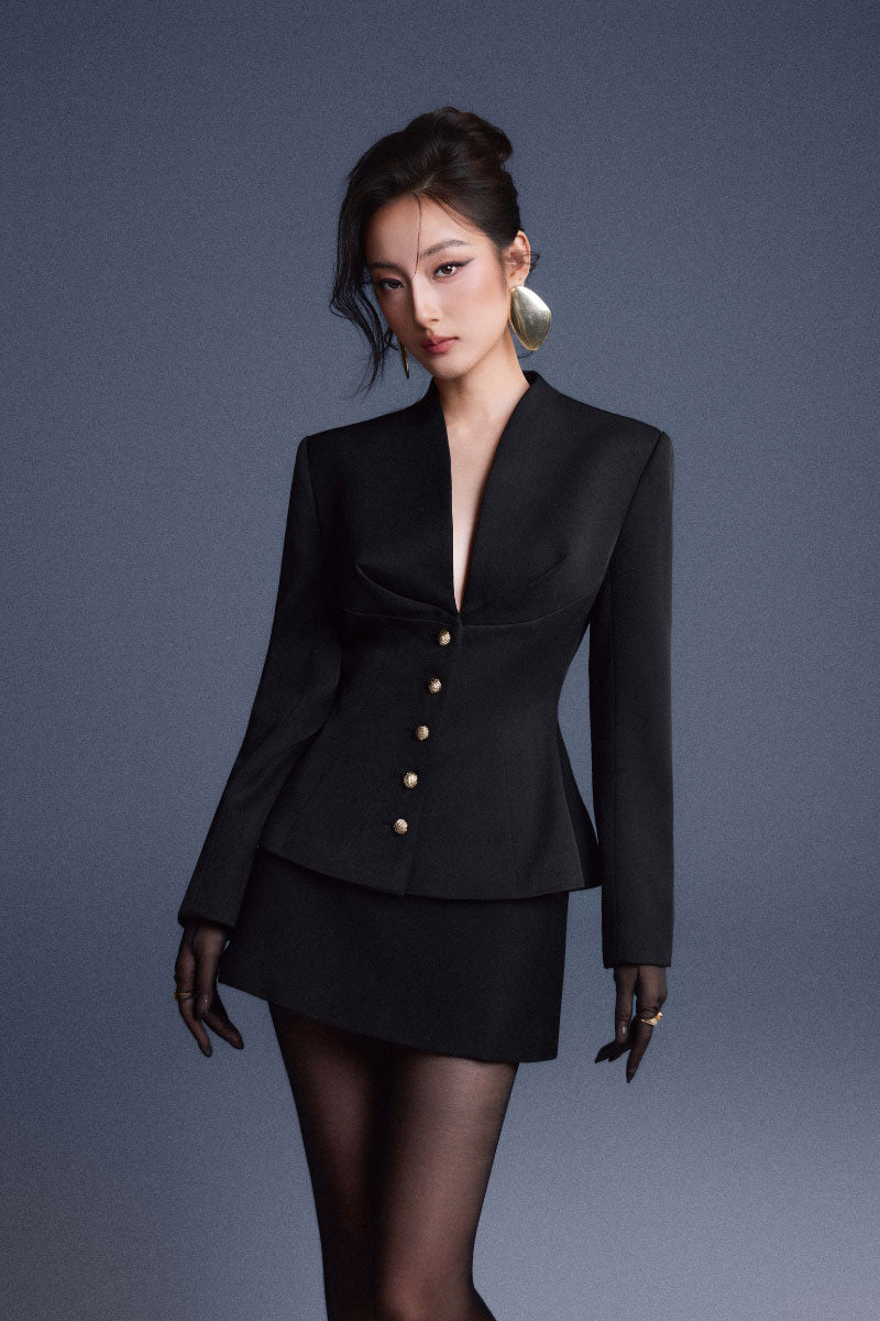 Black folded buttons top by Keira Tong, featuring a stylish design with folded button details and a fitted silhouette.
