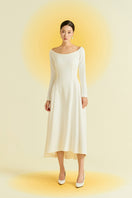White spandex midi dress by EEGEN STUDIO featuring a fitted silhouette and sleeveless design, shown on a model.