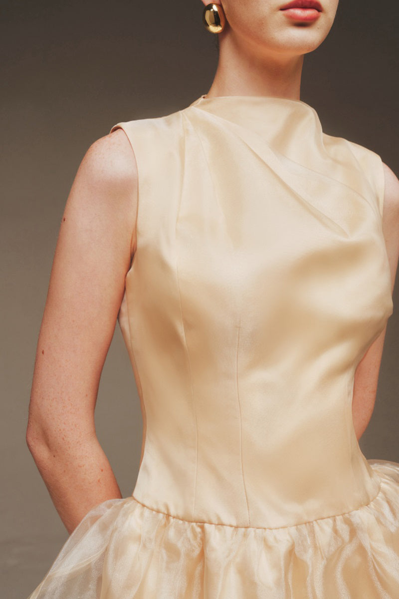 Elegant Margée Atelier Ethereal Rose sculptural maxi gown with flowing fabric and intricate detailing in soft rose tones.