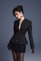 Black folded buttons top by Keira Tong featuring a stylish design and button details, perfect for casual or chic outfits.