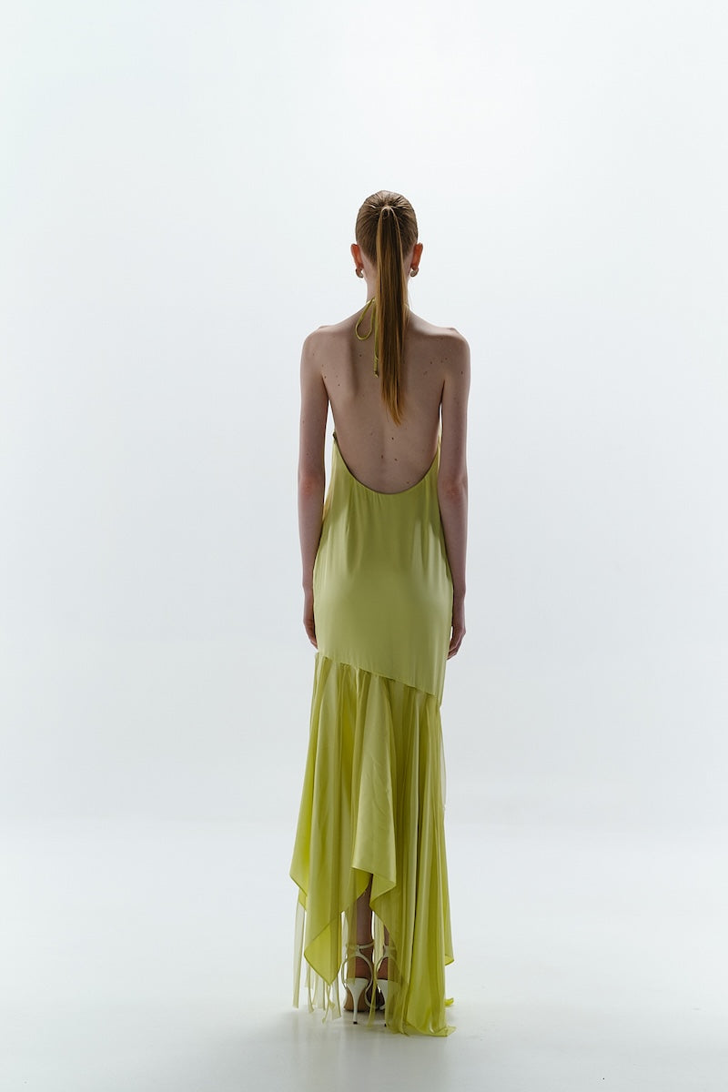 Baobab Ronda Maxi Dress in vibrant green with flowing fabric and floral pattern, perfect for summer occasions.