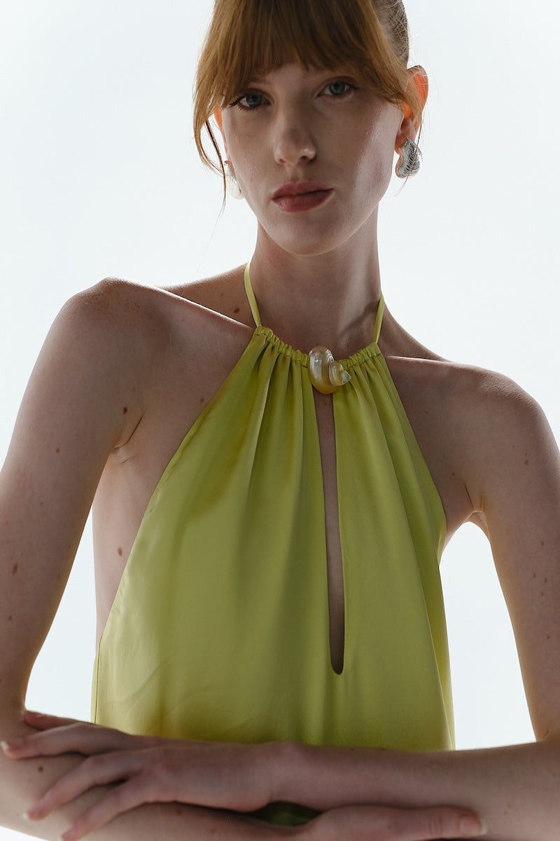 Baobab Ronda Maxi Dress in vibrant green with flowing fabric and sleeveless design, perfect for casual or summer wear.