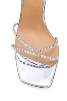 Kolane Kim silver crystal transparent sandals with open toe and block heel, featuring sparkling crystal accents and clear straps.