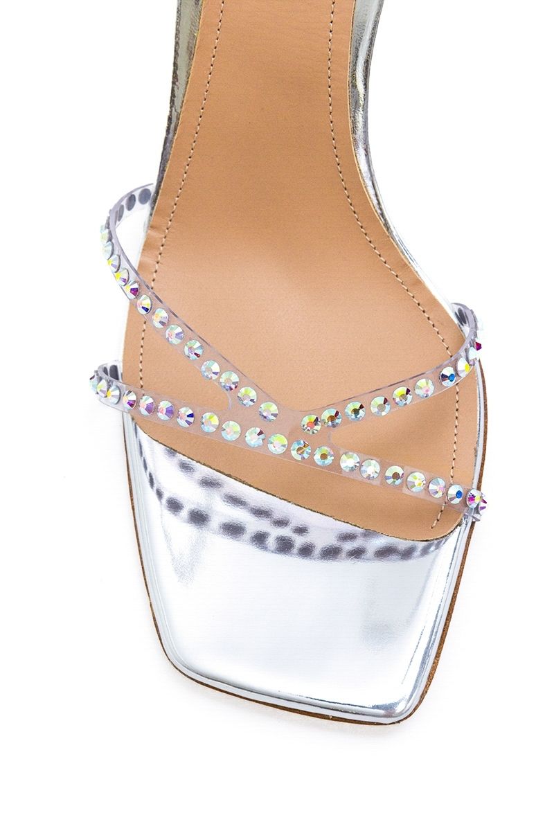 Kolane Kim silver crystal transparent sandals with open toe and block heel, featuring sparkling crystal accents and clear straps.