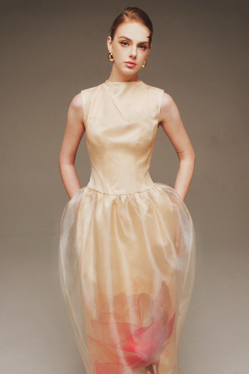 Elegant Margée Atelier Ethereal Rose sculptural maxi gown with flowing fabric and intricate design, showcased on a mannequin.