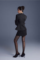 Black folded button top by Keira Tong featuring a stylish design with folded details and button accents.