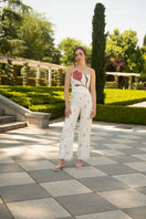 Estefania ivory tulip pants showing high-waisted design, soft fabric, and relaxed fit with floral-inspired silhouette.