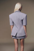 Gray short-sleeve blazer by Keira Tong, tailored fit with lapel collar, shown on a mannequin.
