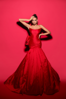 Elegant Cameron Red Bow Trumpet Gown by Tarık Ediz featuring a fitted silhouette and bow detail at the waist.