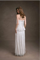 Keira Tong fringe lace maxi dress featuring a fitted bodice, intricate lace details, and flowing skirt with fringe accents.