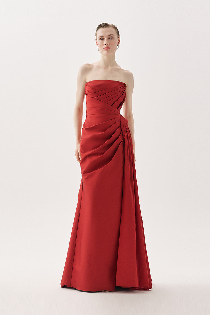 Elegant Tarık Ediz Madrona gown in wine color, featuring flowing fabric and stylish design for formal occasions.