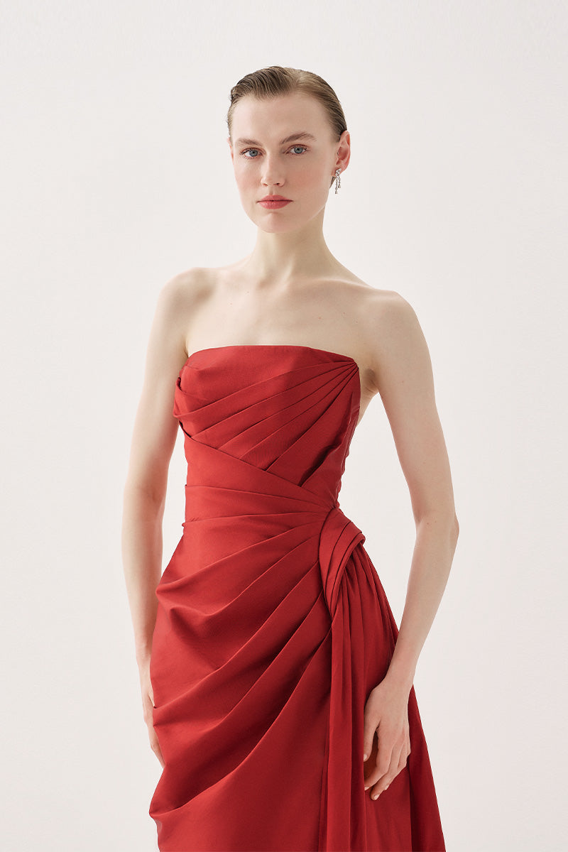 Elegant Tarık Ediz Morona gown in wine color featuring intricate detailing and flowing fabric for formal occasions.