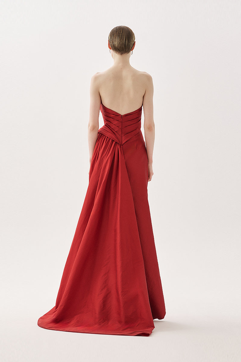 Elegant Tarık Ediz Madrona gown in wine color, featuring a flowing design and intricate details for formal occasions.
