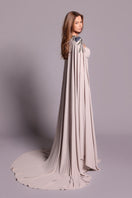 Tarık Ediz Gertie Mink gown shown from the back, elegant evening dress with intricate design and flowing fabric.