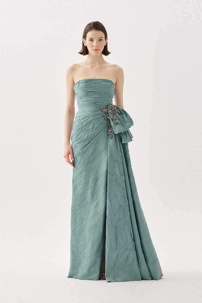 Elegant Tarık Ediz Marlow gown in Blue Haze featuring flowing fabric and intricate details, perfect for formal occasions.