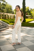 Estefania ivory tulip pants with a relaxed fit, featuring a high waist and flowy fabric, perfect for stylish casual wear.