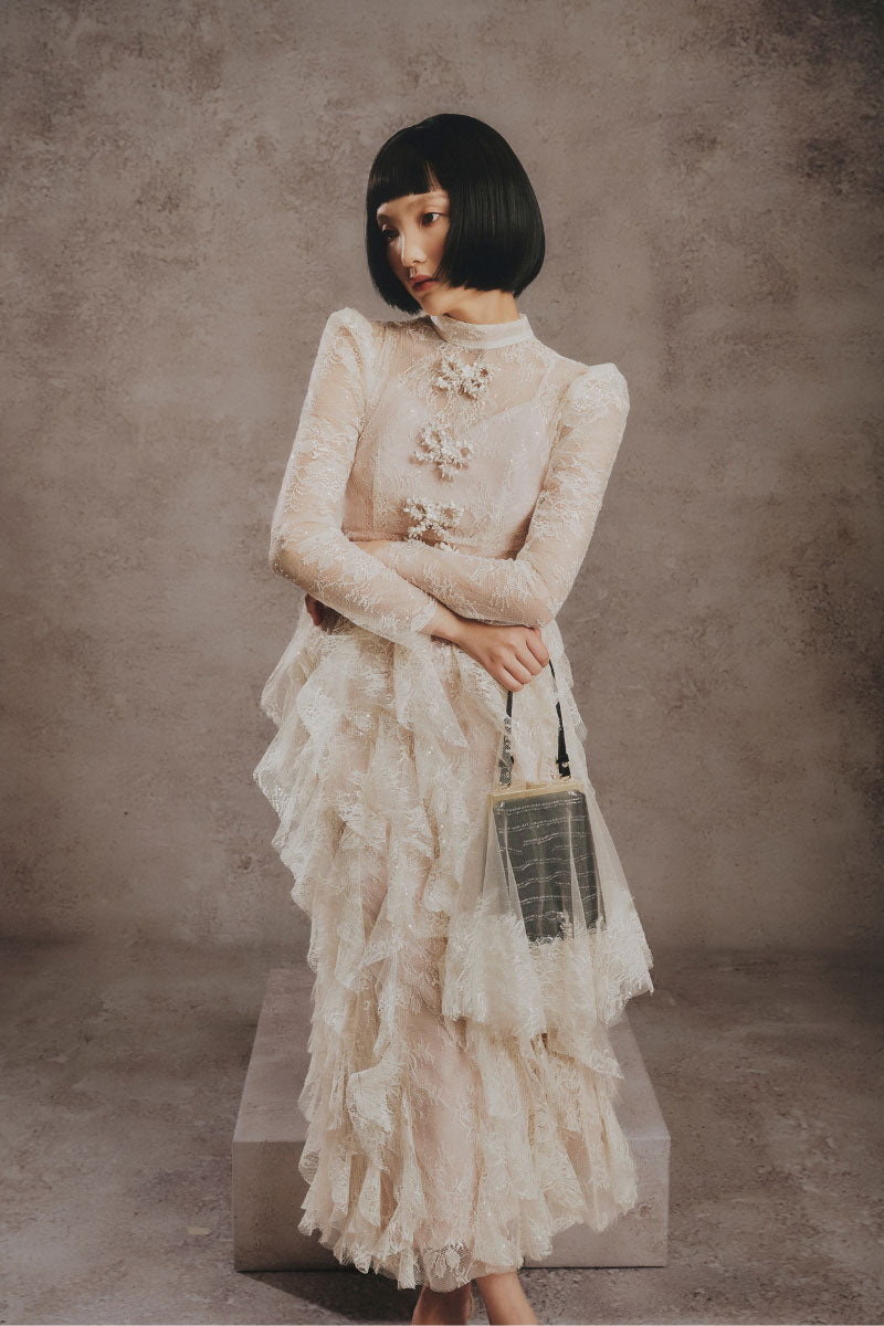 White Plan blush feather romance gown featuring a flowing, elegant design with feather accents and a romantic silhouette.
