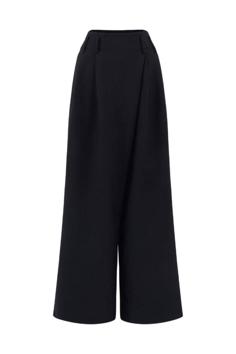 Black Arti Apparel LYN pants with a tailored fit, shown on a model, featuring a sleek, modern design and clean lines.