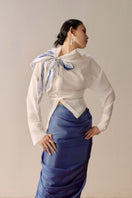 White asymmetrical floral shirt by Lecia featuring a stylish design with floral patterns and a modern, unique silhouette.